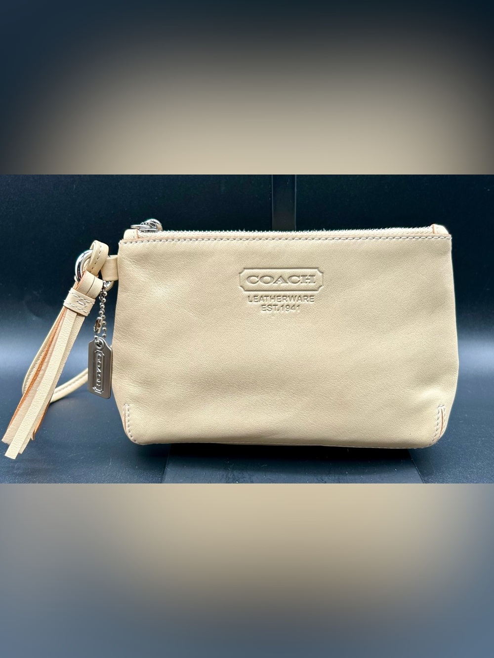COACH Beige Leather Wristlet.